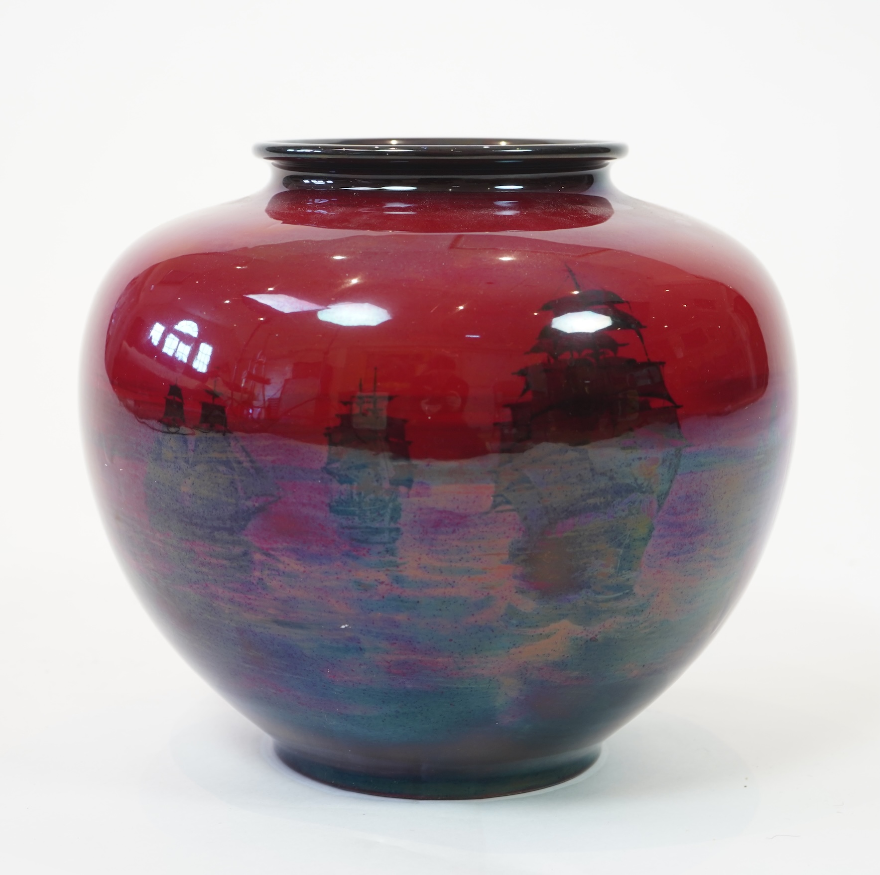 A large Doulton flambe vase decorated with ships, 29cm high